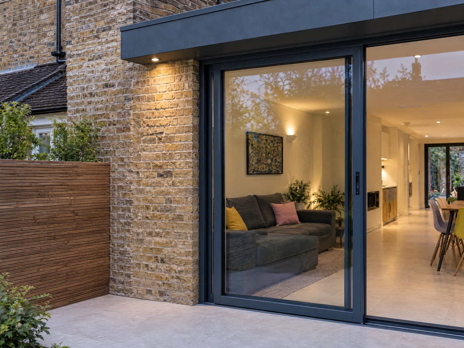 Brickwork and dark aluminium glazing detail on a Wanstead extension